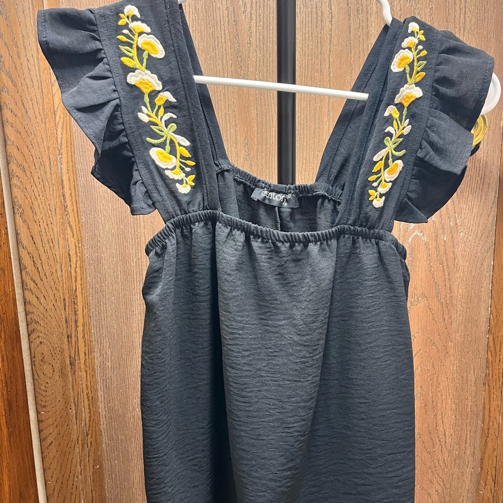 black embroidered-strap swing top
